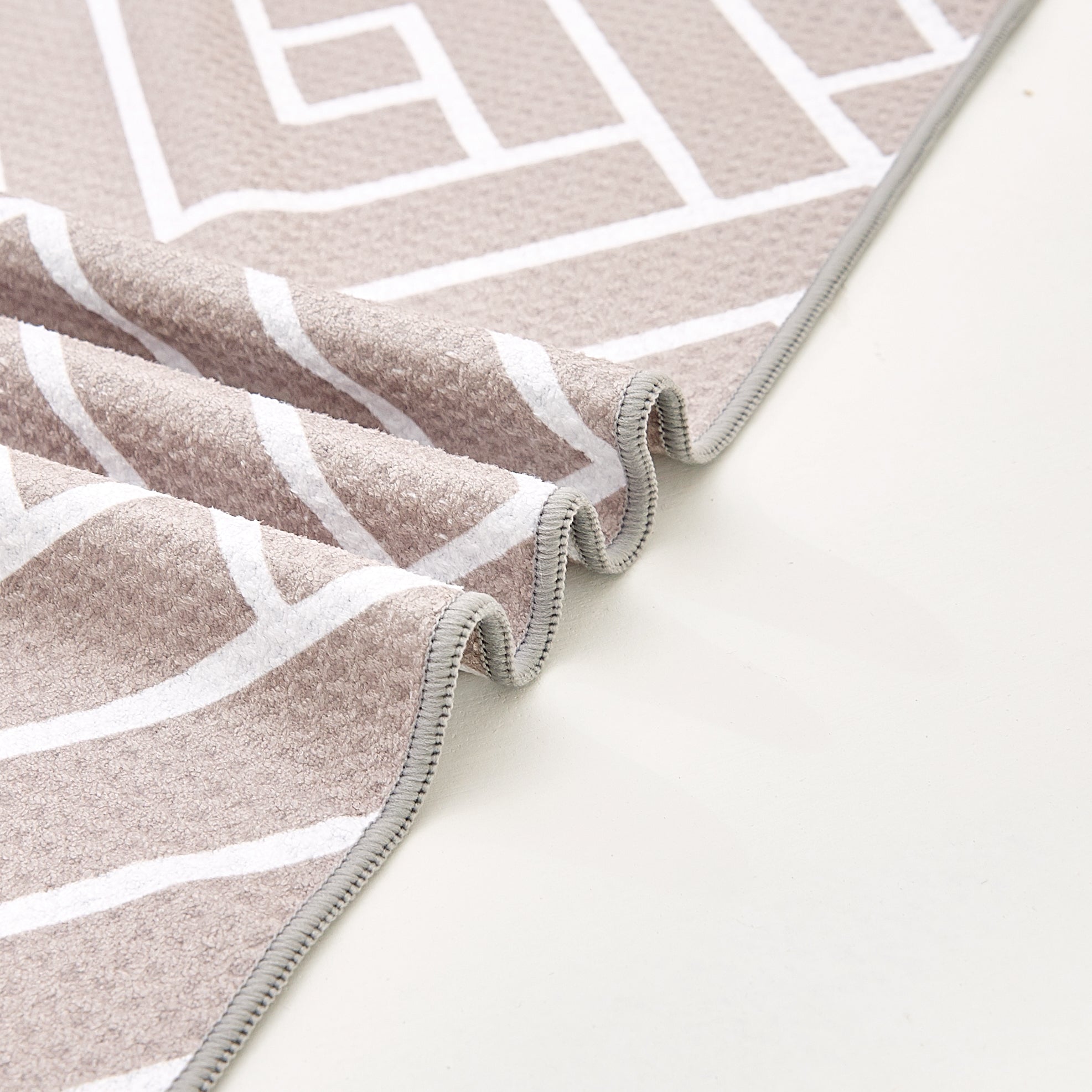 Close-up of sandstone waffle-weave microfibre bath towel