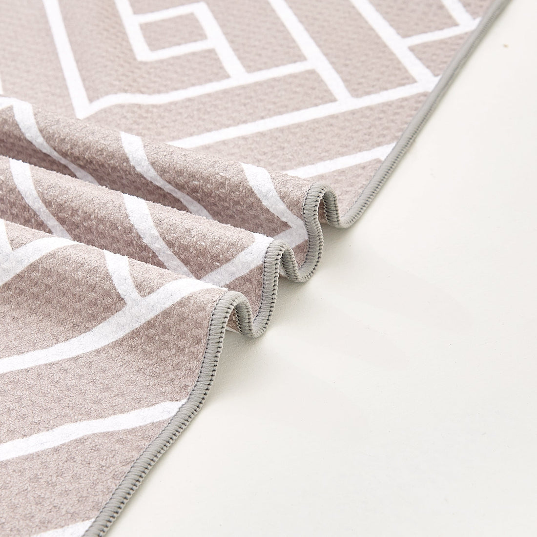 Close-up of sandstone waffle-weave microfibre bath towel