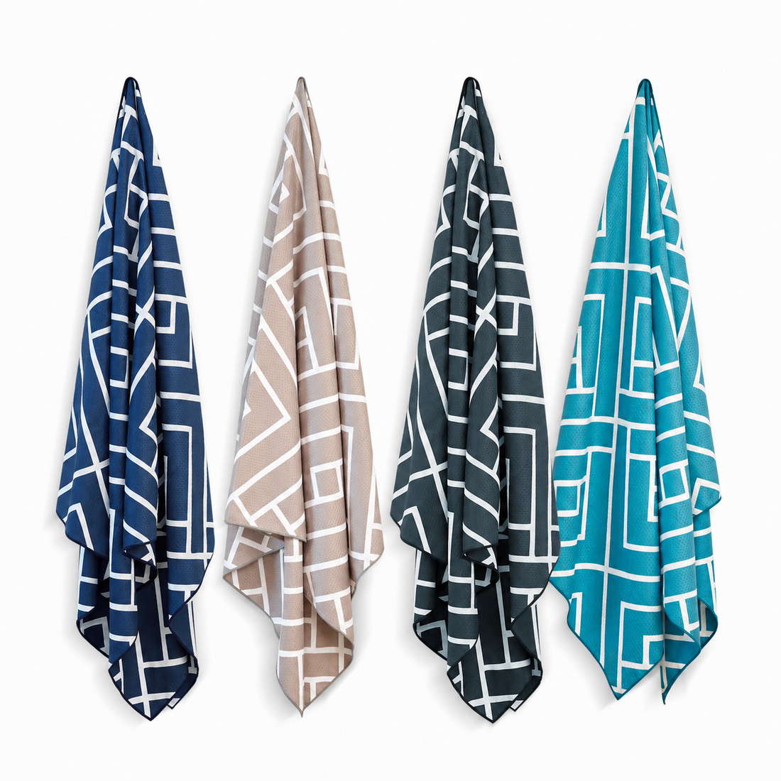 Four Newlyfe waffle-weave bath towels in Navy, Sandstone, Slate and Teal